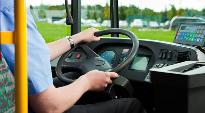 Bus driver sitting in his bus on tour